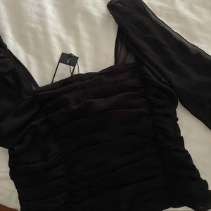 Black ruffled crop top